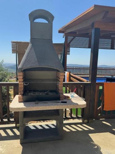 a brick oven sitting on top of a patio at אחוזת קסם הנוף in ‘Ein el Asad
