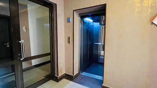 a glass door to a shower in a building at ASTORIA II Apartment 13 One Bedroom Parter in Elenite