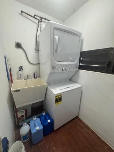 a small bathroom with a sink and a shower at Casa Rosado Villa Marina Fajardo Yunque Seven Seas in Fajardo