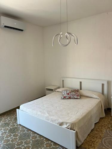 Ένα ή περισσότερα κρεβάτια σε δωμάτιο στο Casa sul mare