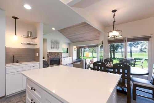 a kitchen and dining room with a table and chairs at Canyon Rim at Eagle Crest in Redmond