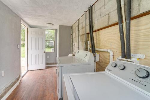 a kitchen with a sink and a washing machine at Newly Renovated Unit Near Dtwn Tulsa and Hospitals! in Tulsa