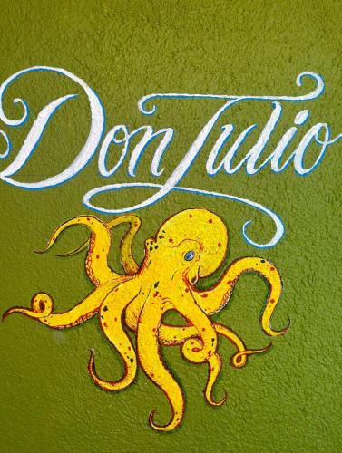 a drawing of an octopus next to the wordonillin at Agave Hotel Club in Buenavista