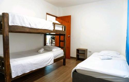 Voodi või voodid majutusasutuse Cabaña Pandu toas