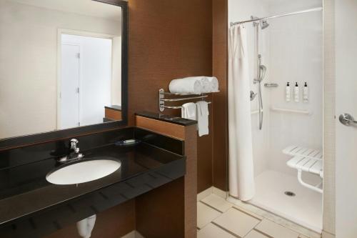 a bathroom with a sink and a shower at Fairfield Inn & Suites by Marriott Reading Wyomissing in Wyomissing