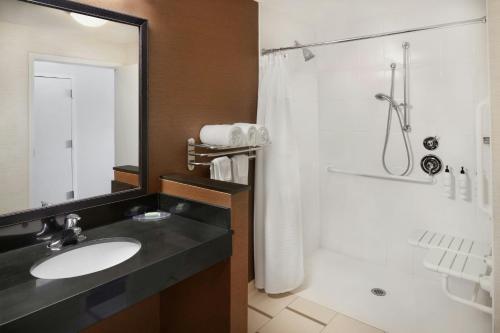 a bathroom with a sink and a shower at Fairfield Inn & Suites by Marriott Reading Wyomissing in Wyomissing