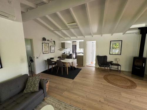a living room with a couch and a table at 6 person holiday home in Haderslev in Haderslev