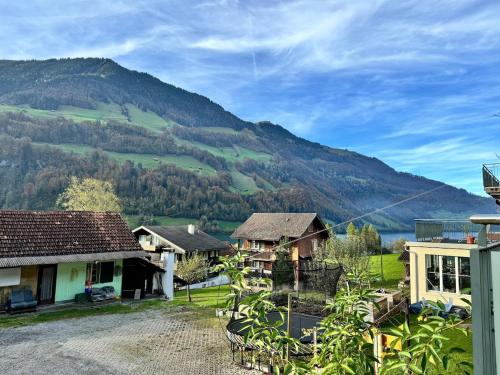 a view of a village with mountains in the background at Bijou N 2 Lungern in Lungern