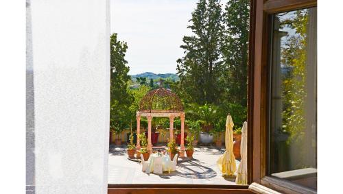 a view of a gazebo from a window at Residenza il Poggione in Fauglia