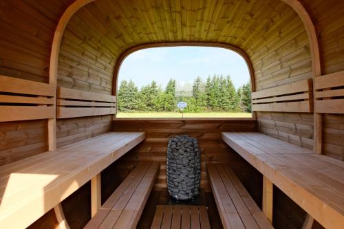 an inside of a sauna with a window at Cavendish Lodge & Cottages in Cavendish