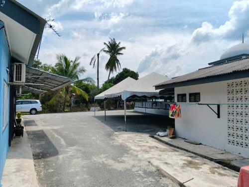 a parking lot in front of a building at Homestay Masjid Seberang Marang in Marang