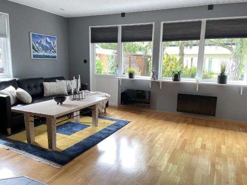 a living room with a couch and a table at 4 star holiday home in LÖDDEKÖPINGE in Löddeköpinge