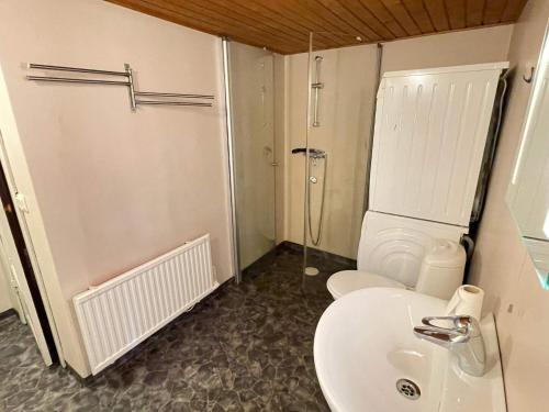 a bathroom with a sink and a toilet and a shower at 4 person holiday home in ESLÖV in Eslöv