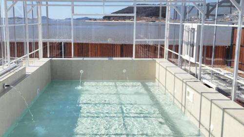 a swimming pool on top of a building at Taean Maru Private Pool Villa in Taean