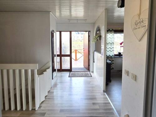 a hallway of a house with a staircase and a door at 4 star holiday home in Ljusne in Ljusne