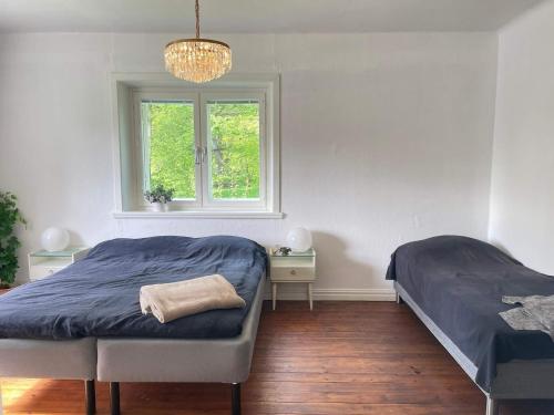 a bedroom with two beds and a window at 5 person holiday home in Stehag in Stehag