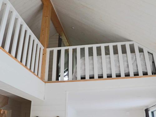 a white staircase in a room with a ceiling at 5 star holiday home in UGGLARP in Ugglarp