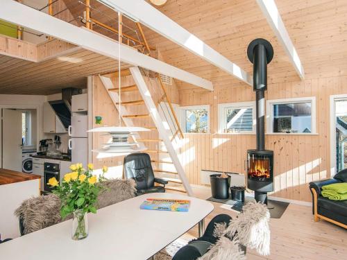 a living room with a fireplace in a tiny house at 4 star holiday home in in Give