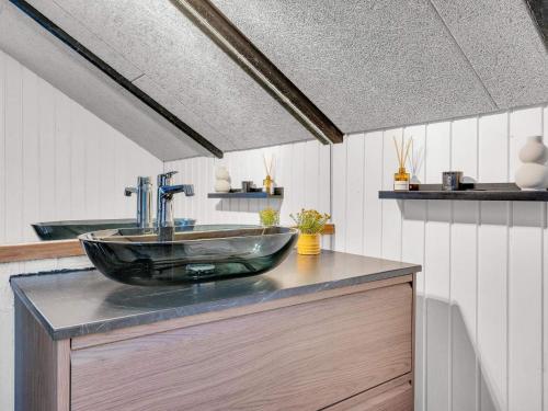 a bathroom with a glass sink on a counter at 5 person holiday home in Silkeborg in Silkeborg