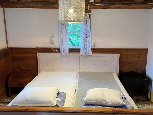 Ένα ή περισσότερα κρεβάτια σε δωμάτιο στο Barn Retreat in the Heart of Gotland