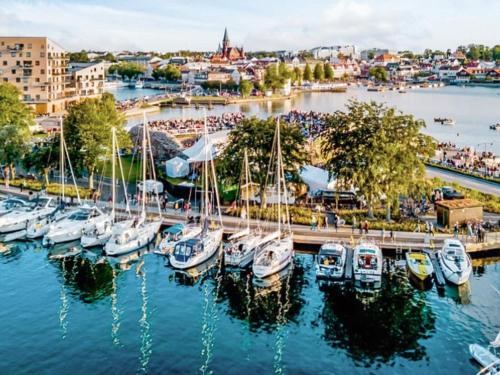 a group of boats docked at a marina at 4 person holiday home in Rättvik in Västervik