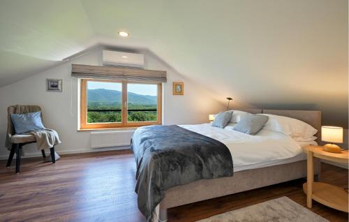 a bedroom with a large bed and a window at Gorgeous Home In Stubicke Toplice in Stubicke Toplice