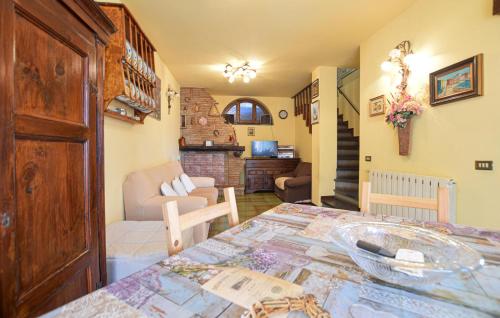 a room with a table and a living room at 3 Bedroom Cozy Home In Camaiore in Camaiore