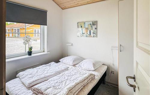 a bed in a room with a window at Pet Friendly Home In Gråsten With Wifi in Gråsten
