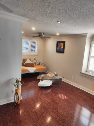 a room with a bed and a table in it at Top Location in DT TORONTO- CN TOWER VIEW in Toronto