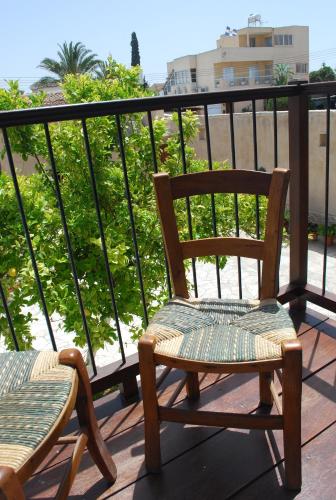 a pair of chairs sitting on a balcony at To Archontiko tis Anastasias in Athienou