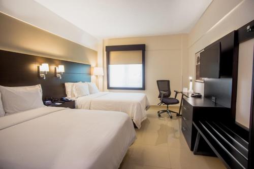 Postel nebo postele na pokoji v ubytování Holiday Inn Express Tapachula by IHG
