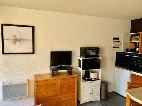 Chalet 24m², 4 pers, balcon sud, parking privatif, aux pieds des pistes Les Menuires - FR-1-344-1224