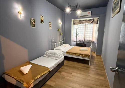 Postel nebo postele na pokoji v ubytování Bayu Beach Resort PortDickson Santai PD Homestay 2 Rooms Apartment