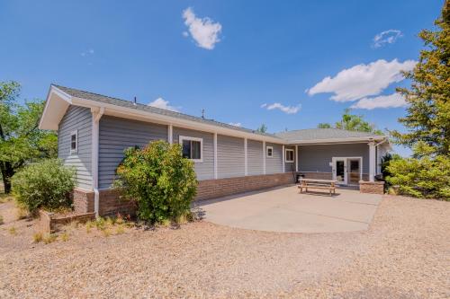a home with a large patio in front of it at Hilltop Heaven - 5 Star Comfort and Views in Panguitch