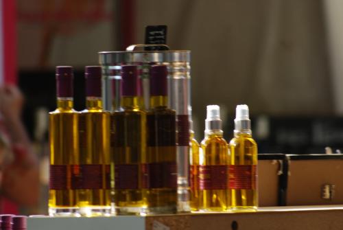 a group of bottles of oil sitting on a box at Olivenhuset in Fons-sur-Lussan