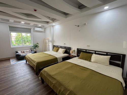 Ένα ή περισσότερα κρεβάτια σε δωμάτιο στο Ngáo Home - Hoa Lư
