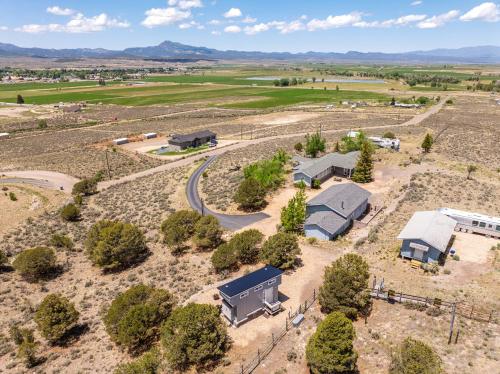 an aerial view of a farm with a building at Hilltop Tiny Home in Panguitch