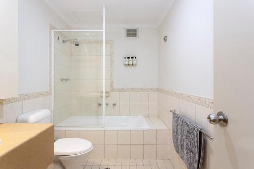 a bathroom with a shower and a toilet at Perth Central CBD convenience! in Perth