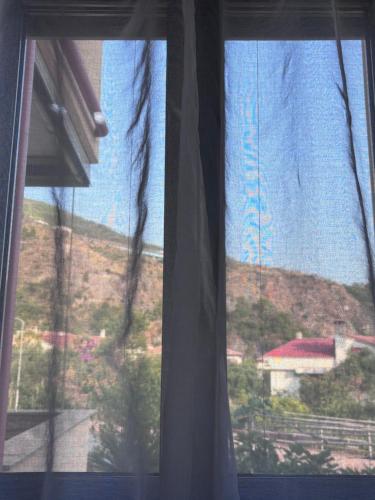 a window with a view of a mountain at Zia Manuccia in Praia a Mare