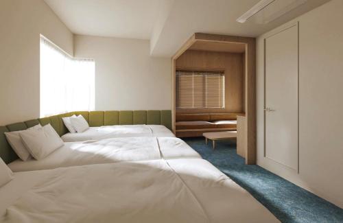 Katil atau katil-katil dalam bilik di HOTEL AMANEK Asakusa Sakurabashi