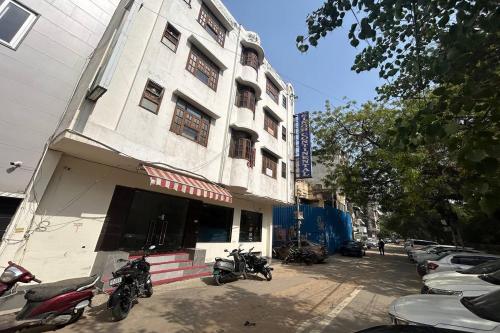 a group of motorcycles parked in front of a building at HOTEL SINGH CONTINETAL in New Delhi