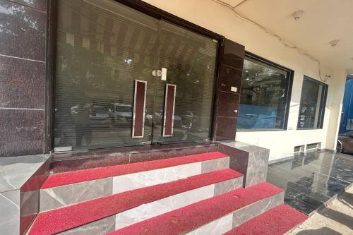 a building with red steps in front of a window at HOTEL SINGH CONTINETAL in New Delhi
