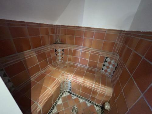 an overhead view of a tiled floor in a bathroom at Bergfohlenhof in Höchst im Odenwald