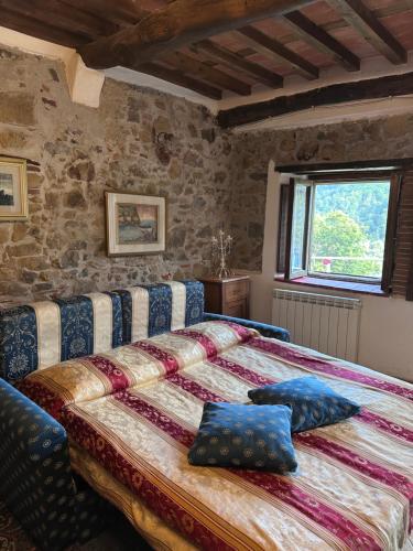 Ένα ή περισσότερα κρεβάτια σε δωμάτιο στο Case Vacanze Giovanni Garibaldi