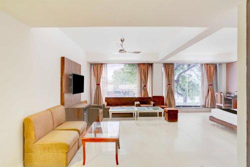 a living room with a couch and a table at Palette Hotel Nisarga by Sunday Bhopal in Bhopal