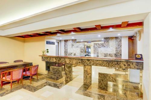a bar in a room with a table and chairs at Palette Hotel Nisarga by Sunday Bhopal in Bhopal