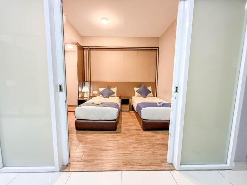 Katil atau katil-katil dalam bilik di HappySty by Golden Hour Maritime Suite