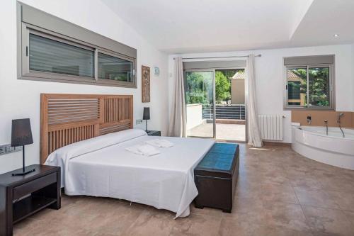 Postel nebo postele na pokoji v ubytování Villa Marioma