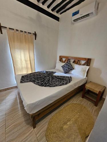 Кровать или кровати в номере Vivi Cafe B&B