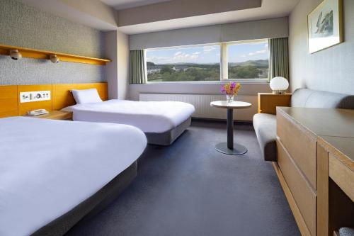 Ένα ή περισσότερα κρεβάτια σε δωμάτιο στο ANA Crowne Plaza Resort Appi Kogen by IHG